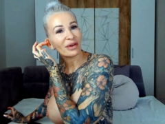 Inked Beauty Shows Off Massive Tits And Toys